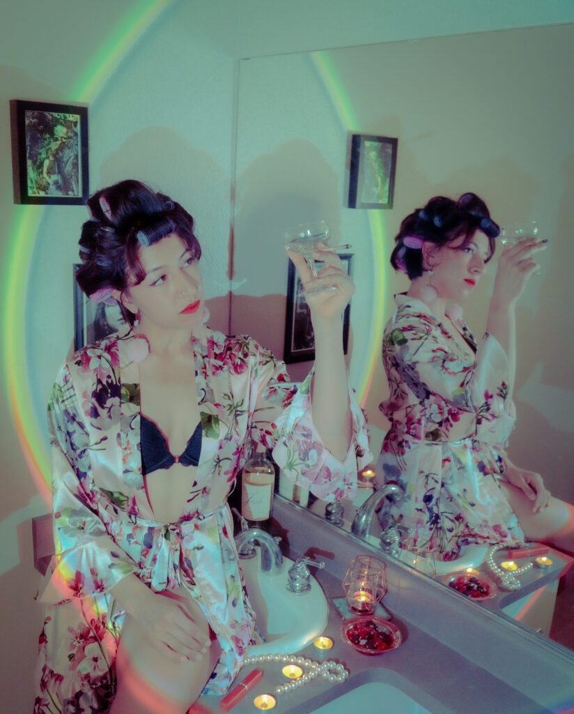 a retro image of a woman in a silk robe on a bathroom sink