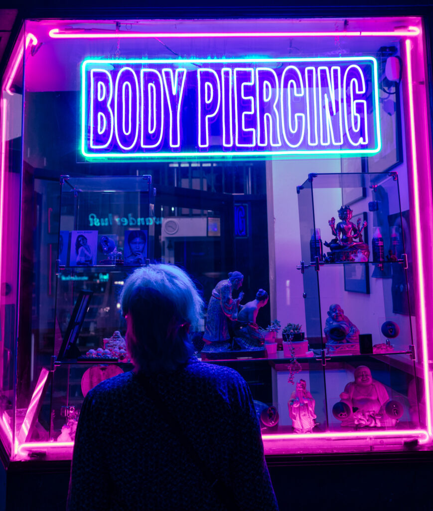 a night shot of a body piercing studio